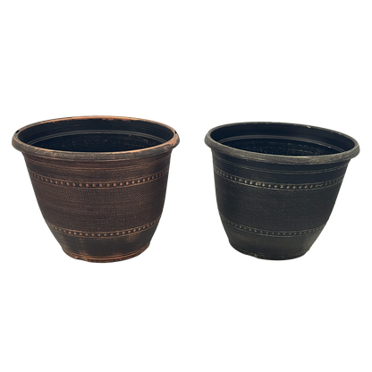 Two black pots, one is copper brushed while the other is Champaign brushed 