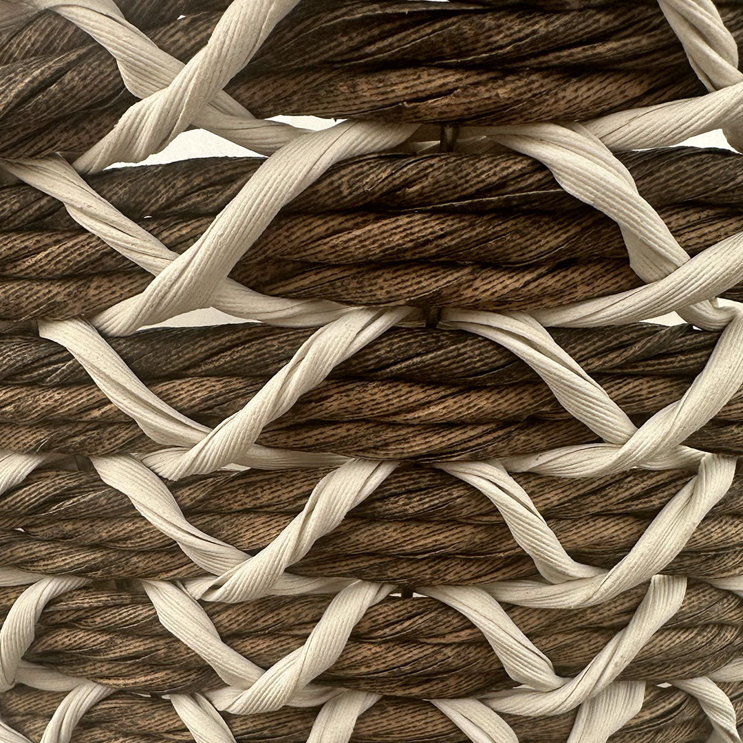 Closeup of brown cone hanging bakset with grey X crisscross pattern