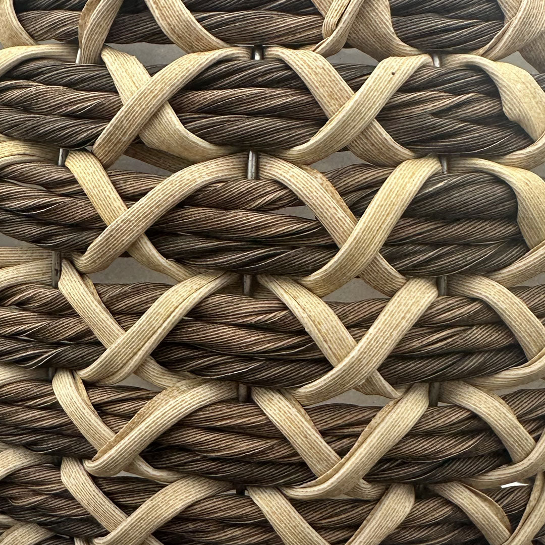 Closeup of brown ball with tan "x" pattern