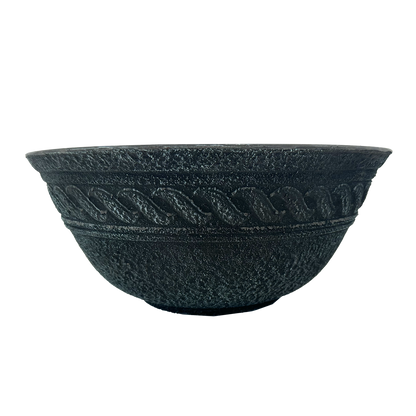 Verdigris bowl planter with raised wave pattern and textured pot