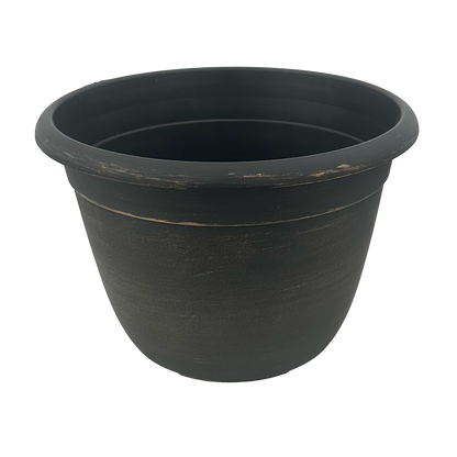 Black pot brushed with gold paint