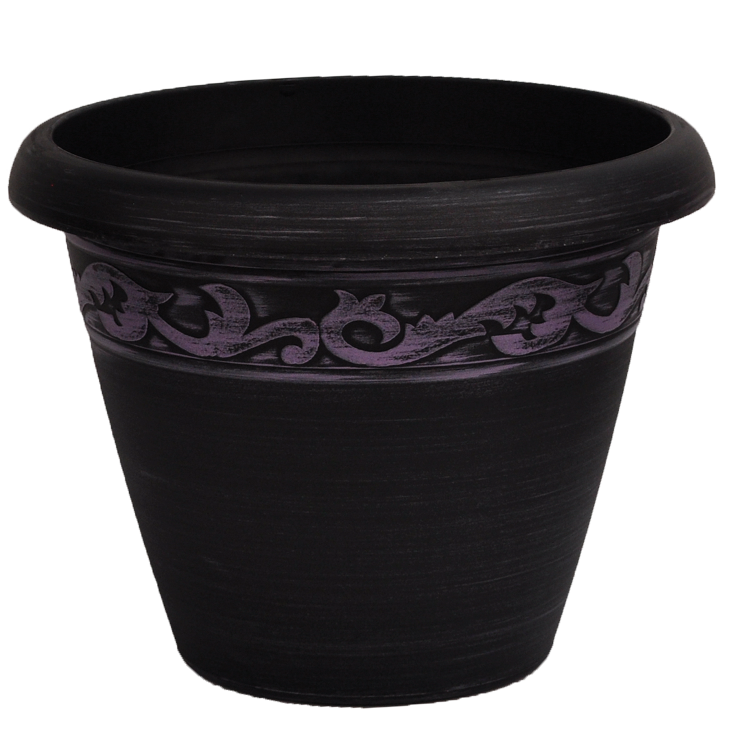 Black pot with brushed purple paint and ornate band towards top of pot